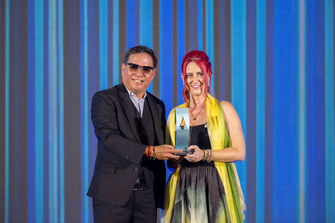 Receiving the IDA Design Award on stage